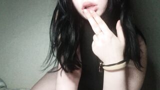 Sexy brunette gently sucks her fingers