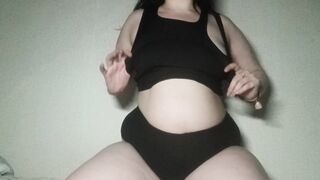 Sexy brunette gently sucks her fingers