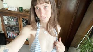 Flat green eyed girl blows you kisses whilst showing tits