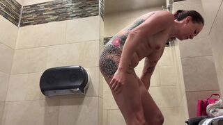 Redhead cleaning her body in truck stop shower — perfect view. Full video in the link on my profile
