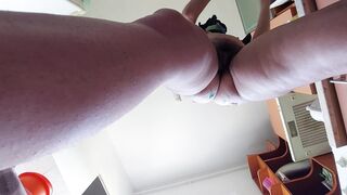 Sexy mom prepares breakfast naked in the kitchen.