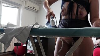 Sexy latina naked in the kitchen. Naked sexy wife prepares food in the kitchen.