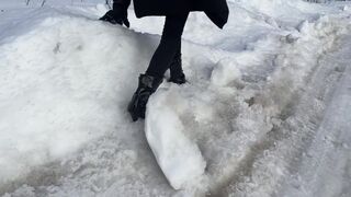 The girl is trying to walk on ice in ballet boots, but her toes are very painful